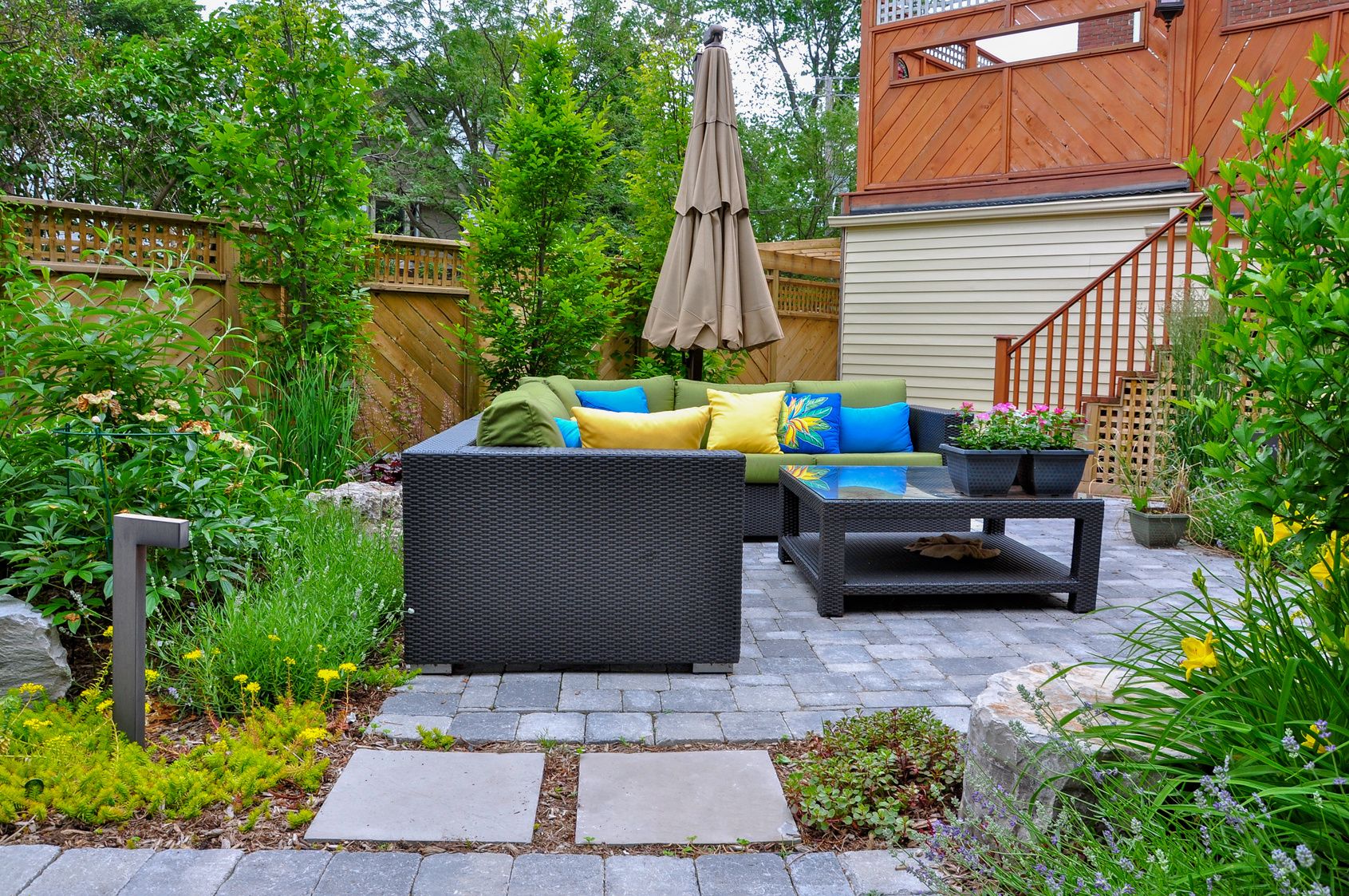 Paver patio with outdoor seating and plantings